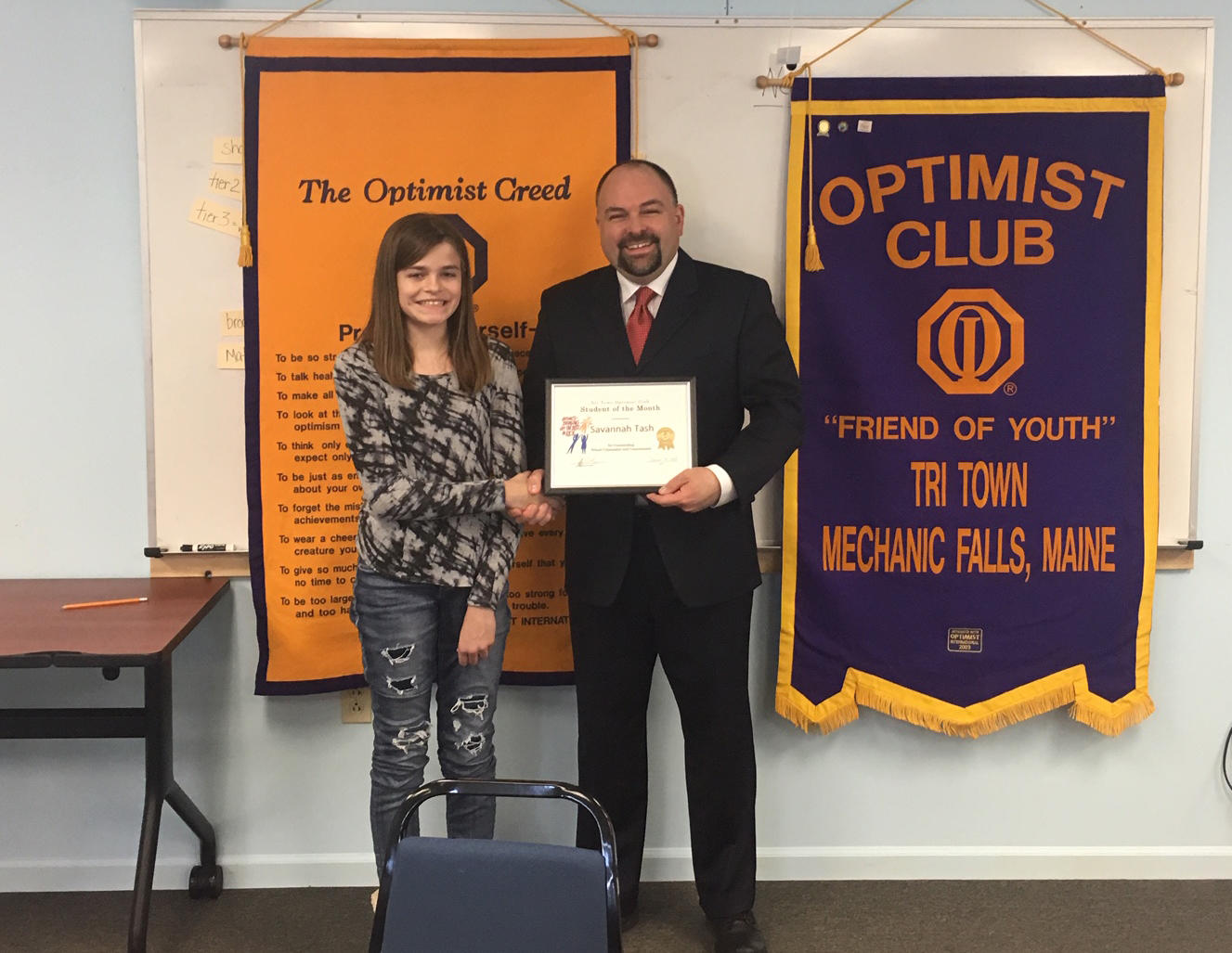 Photo of Savannah Tash receiving the Optimist Club Award at Elm Street School