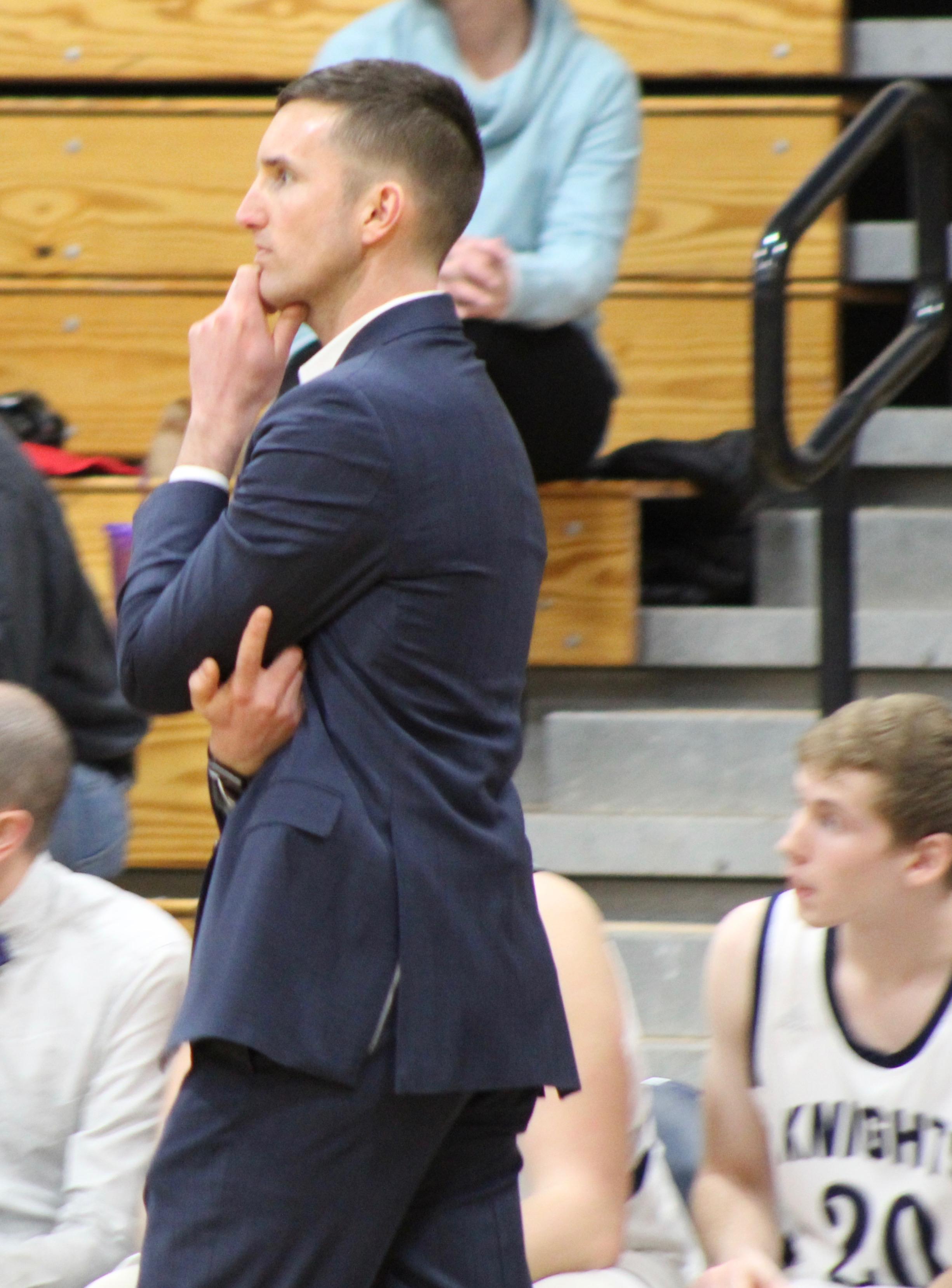 Photo of coach at basketball game at Poland Regional High School