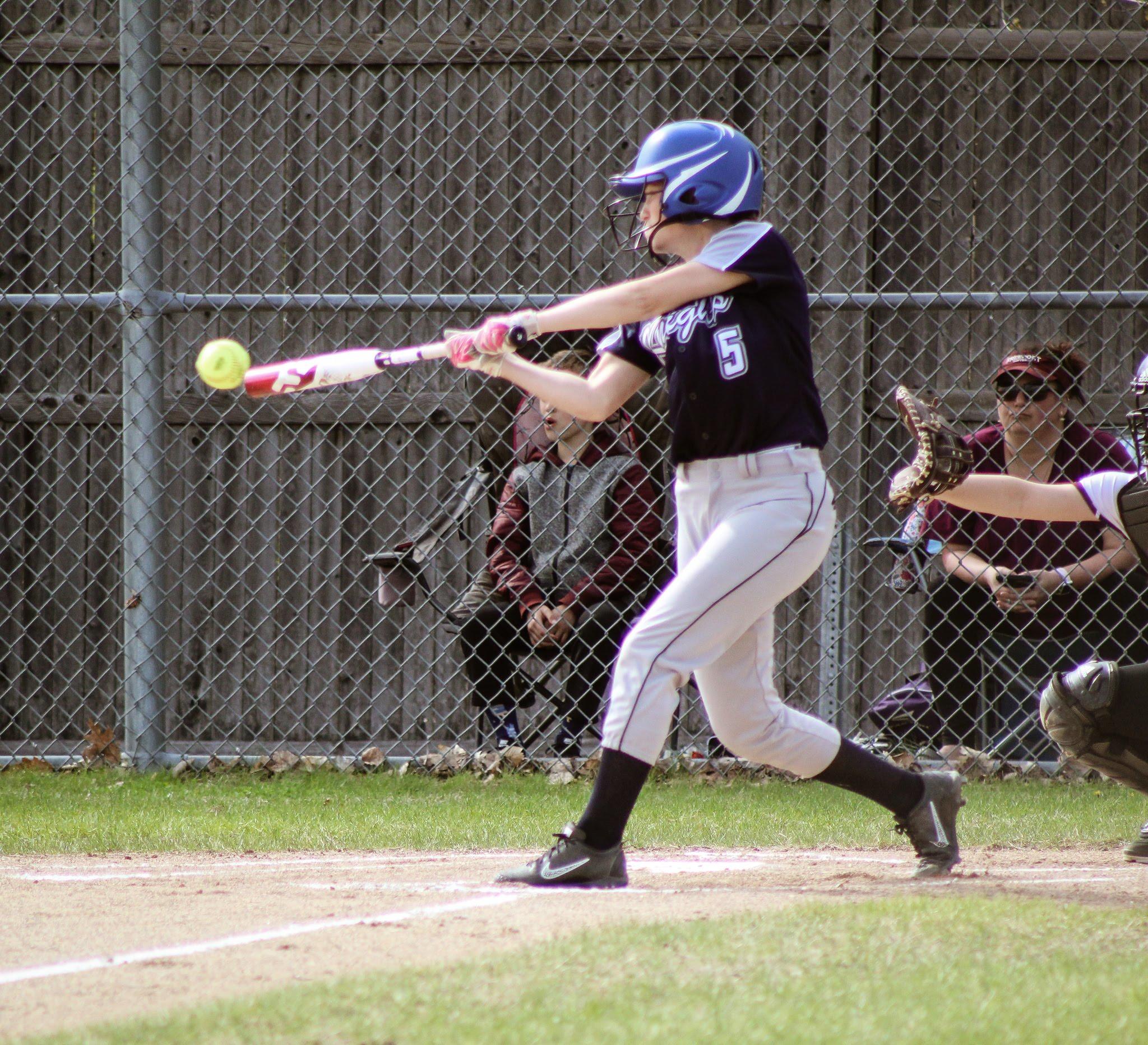 PRHS Girls Softball, 18-19, action photo of batter swinging and partial of catcher.